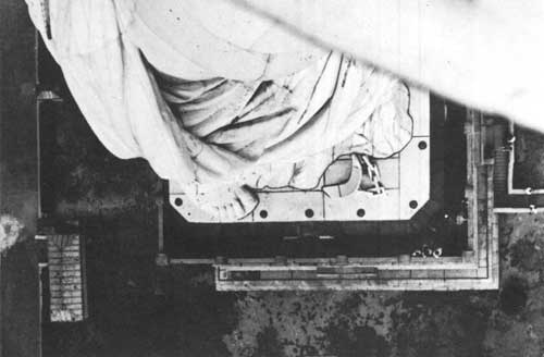 broken shackle at the feet of the statue