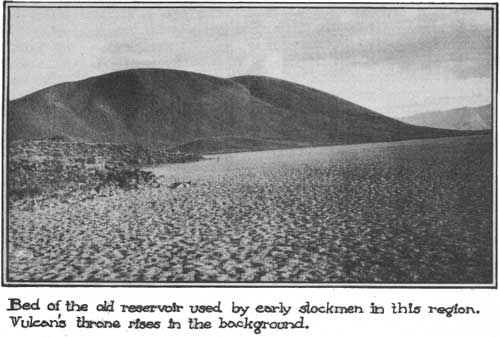 Bed of the old reservoir used by early stockmen to this region. Vulcan's
throne rises in the background.