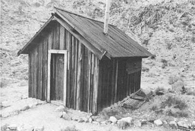 cabin and remains of wooden tent platform