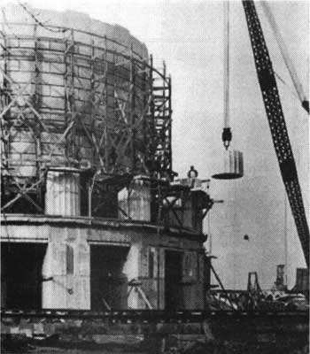 construction crane placing Doric column drum