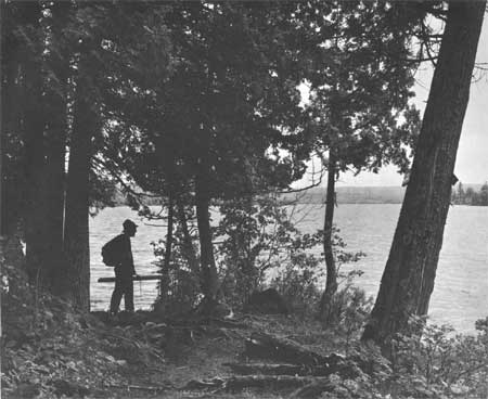 hiker along lakeshore