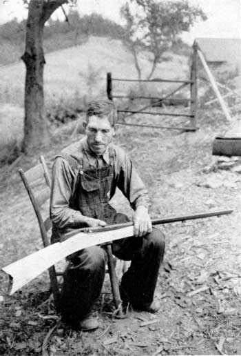 man making a rifle stock