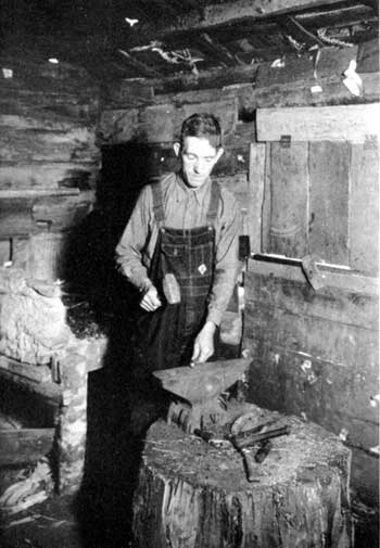 man forging bullet mould
