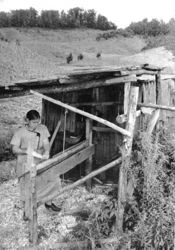 woman working on lathe