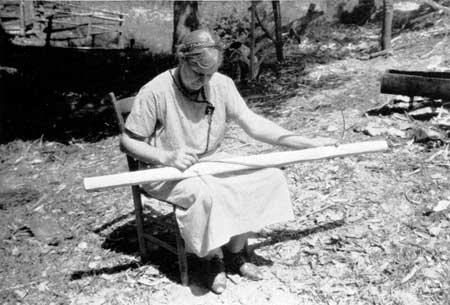 woman wrapping rifling guide